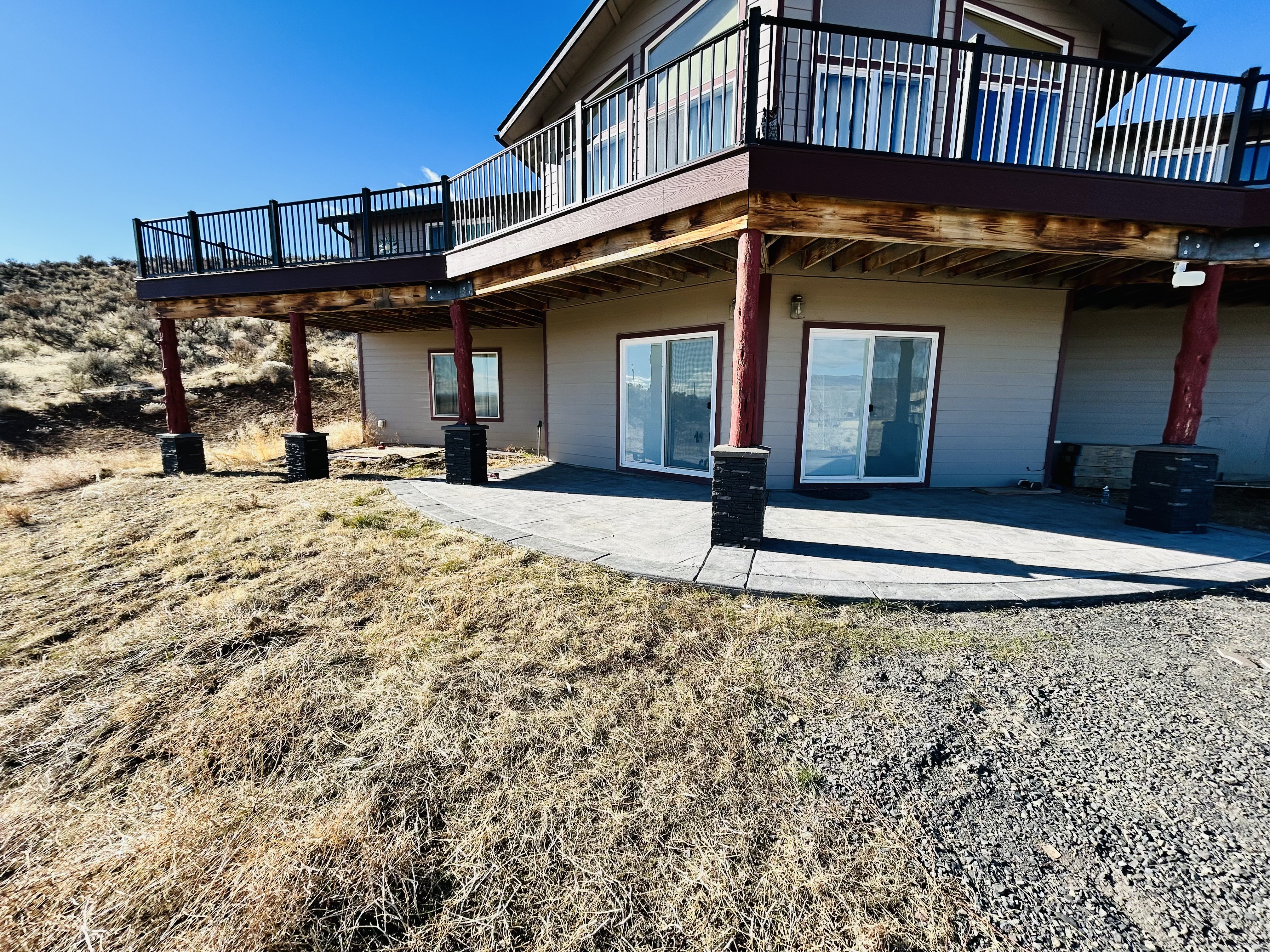 Cedar front deck with tiered steps – housewrap mid-install