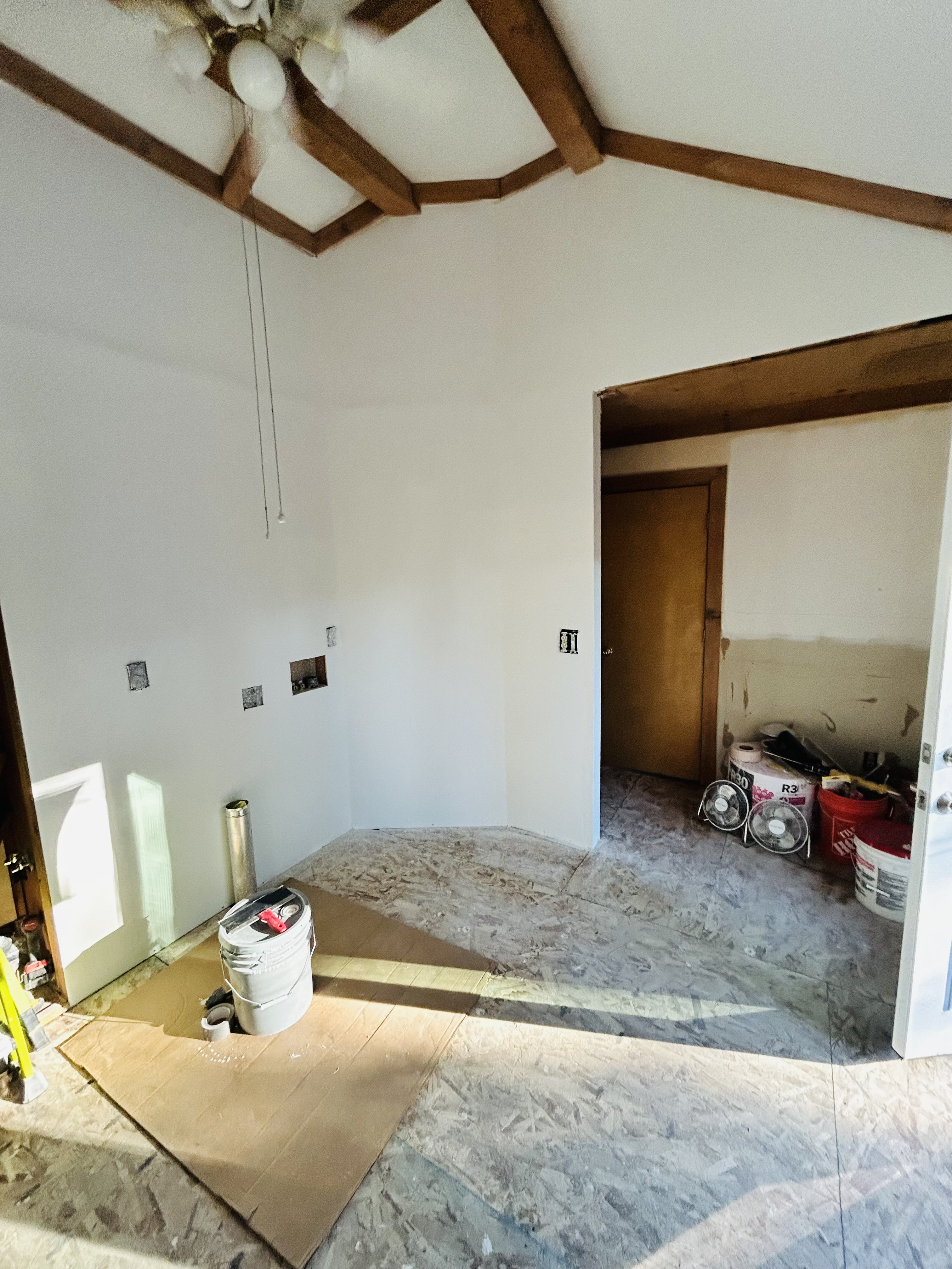 Interior remodel – vaulted beam ceiling room, fresh drywall and paint