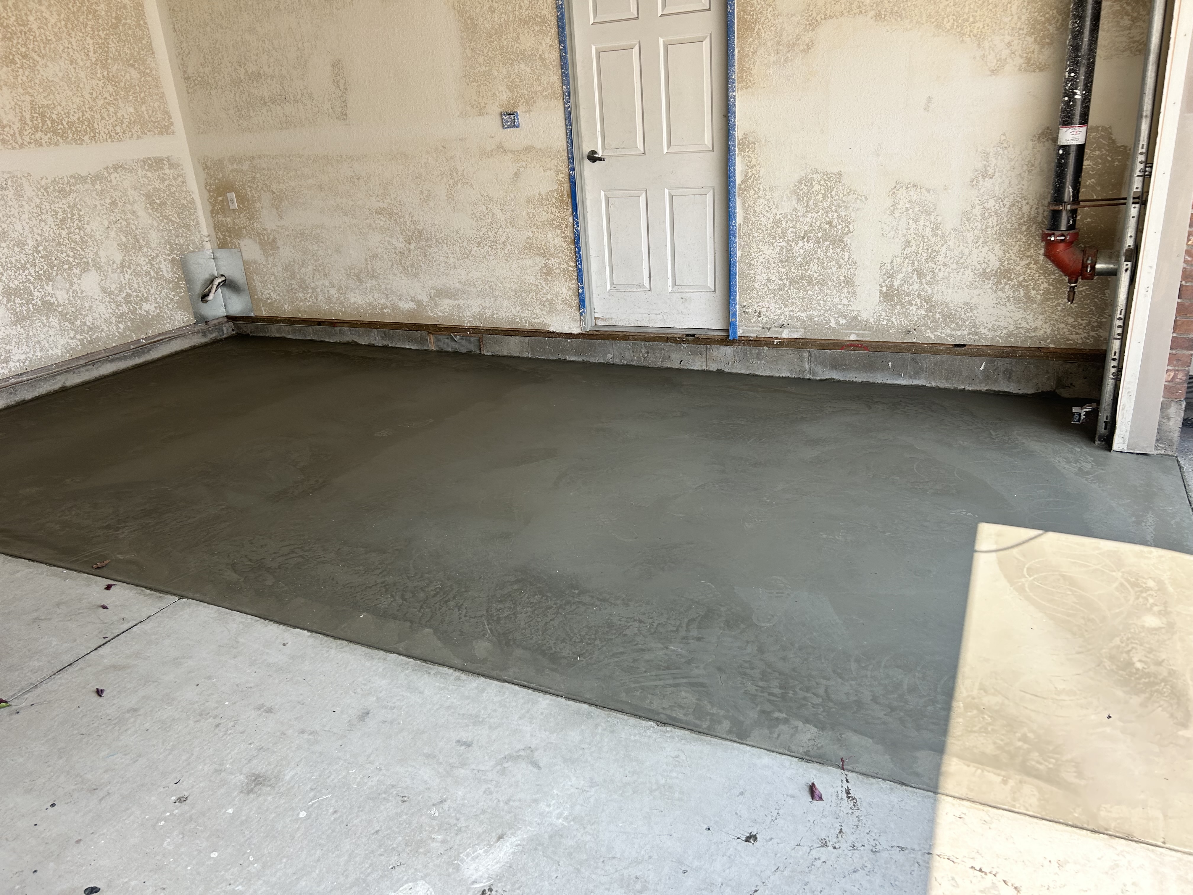 Fresh concrete pour – garage floor finished and smooth