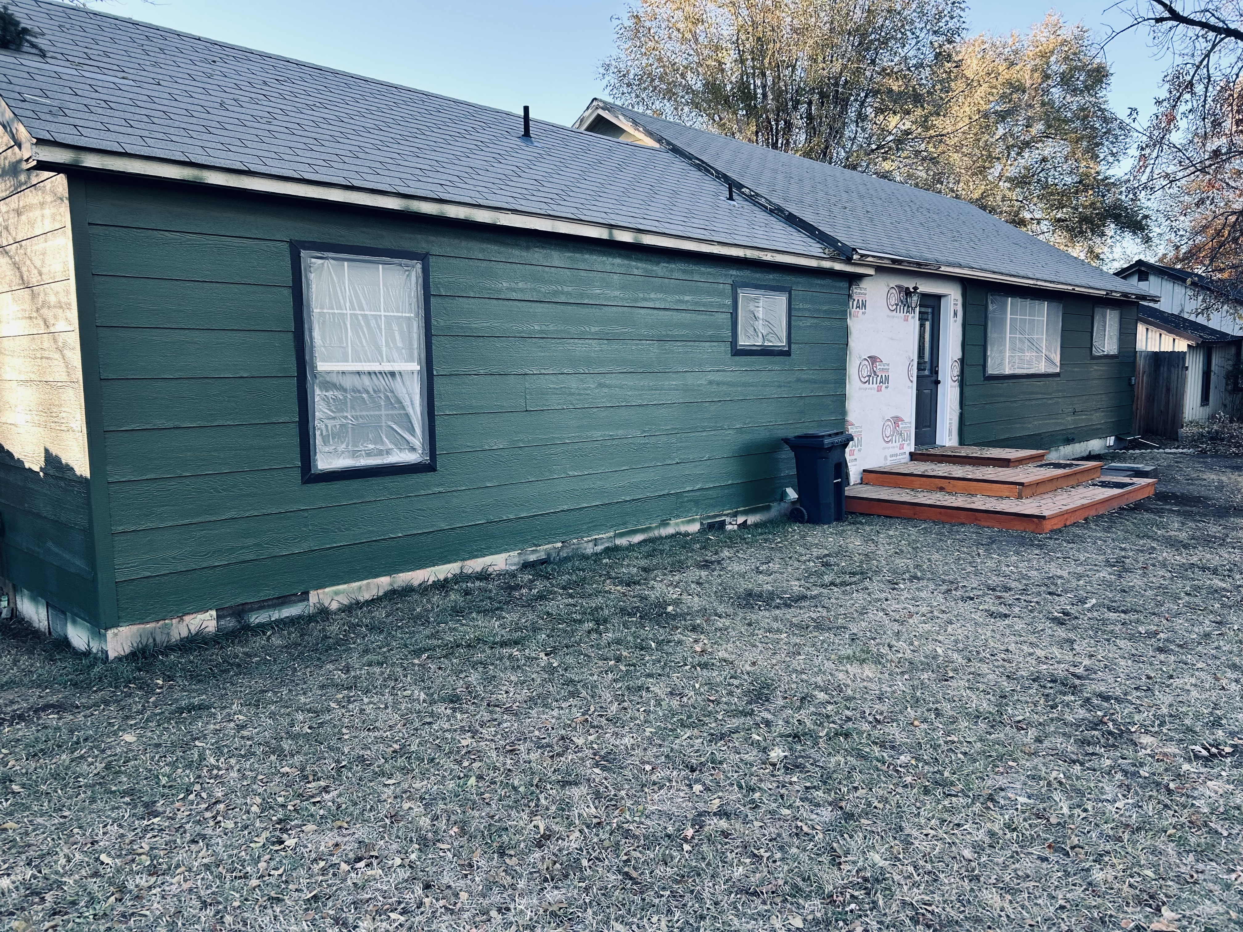 Green house siding – new green siding mid-paint