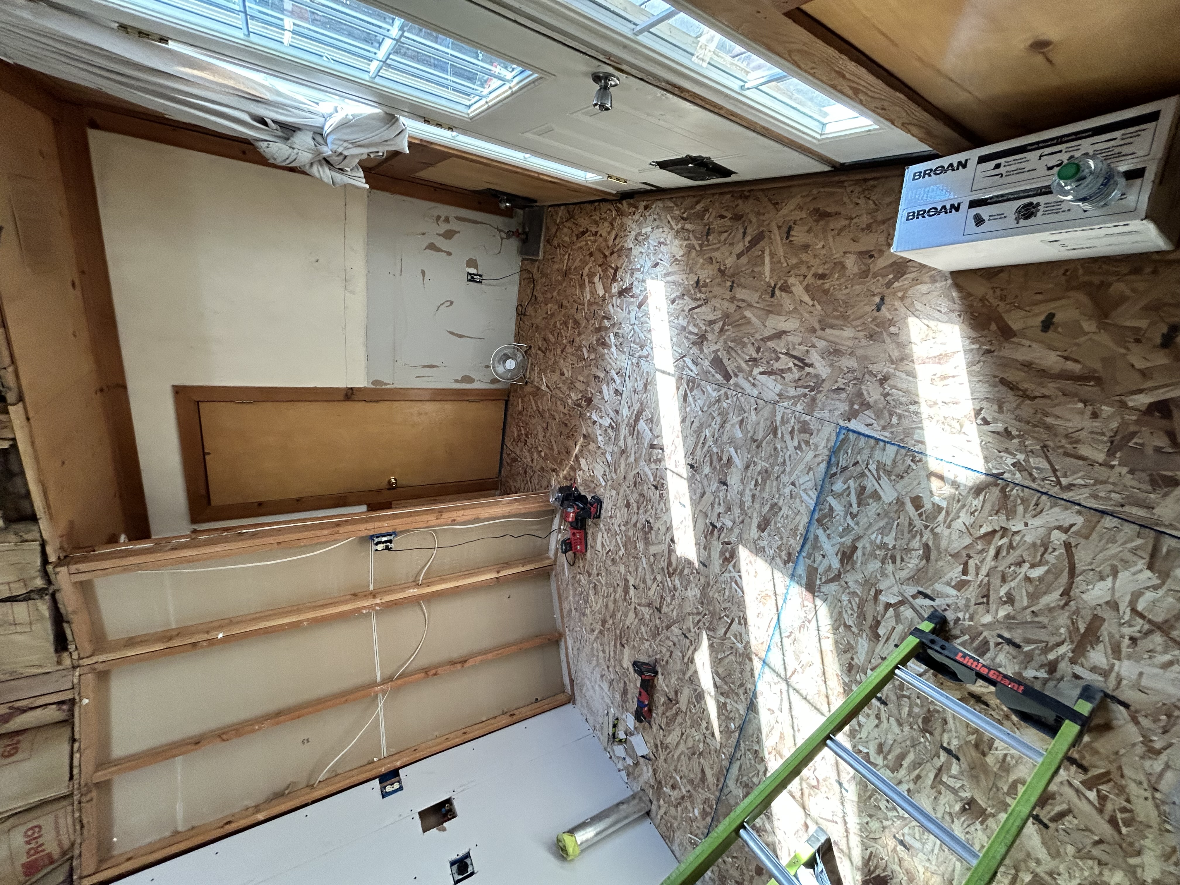 Interior remodel – overhead view of framed room with new subfloor and fresh walls