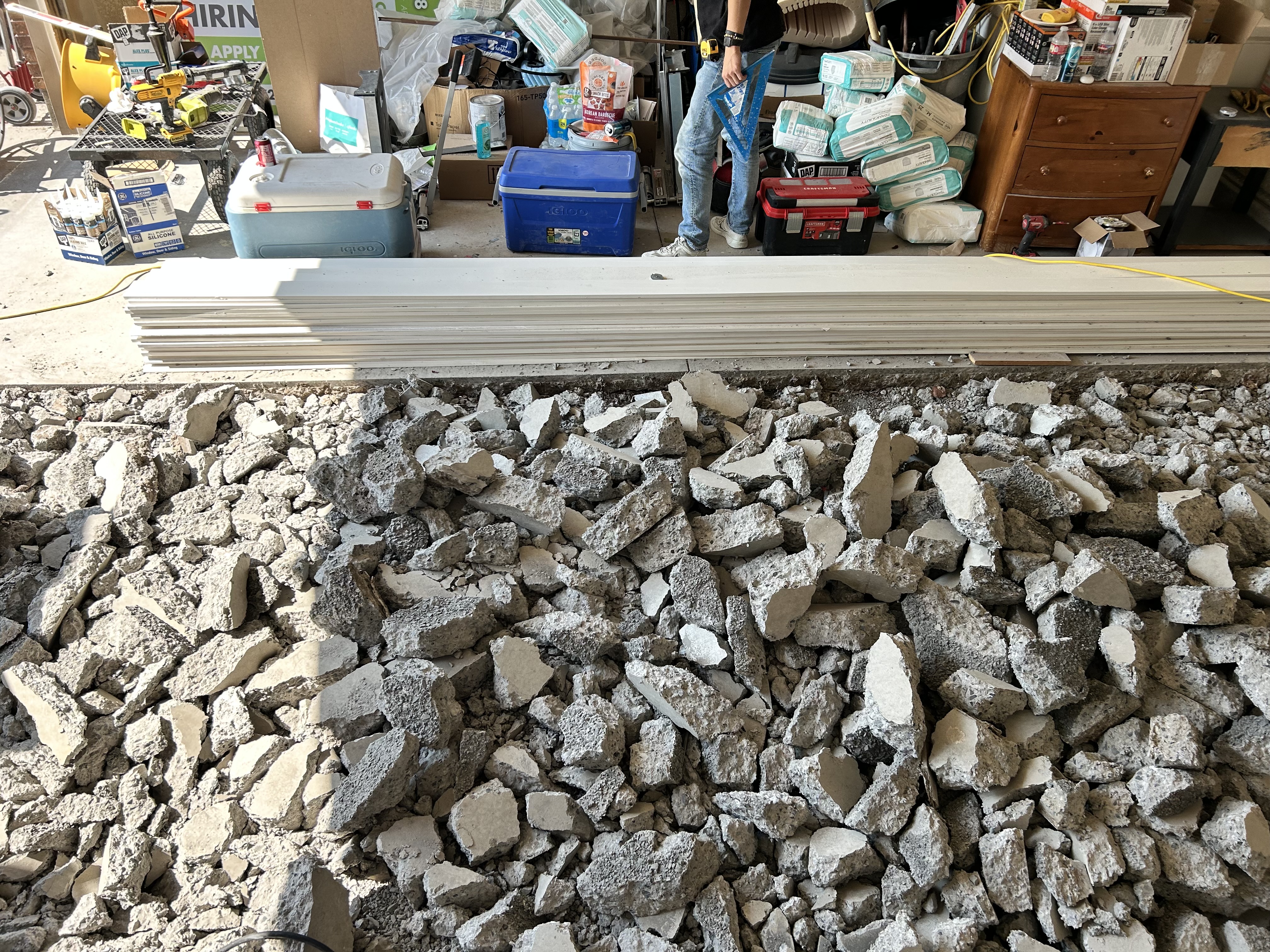 Concrete demo – overhead view of broken slab chunks with new trim boards