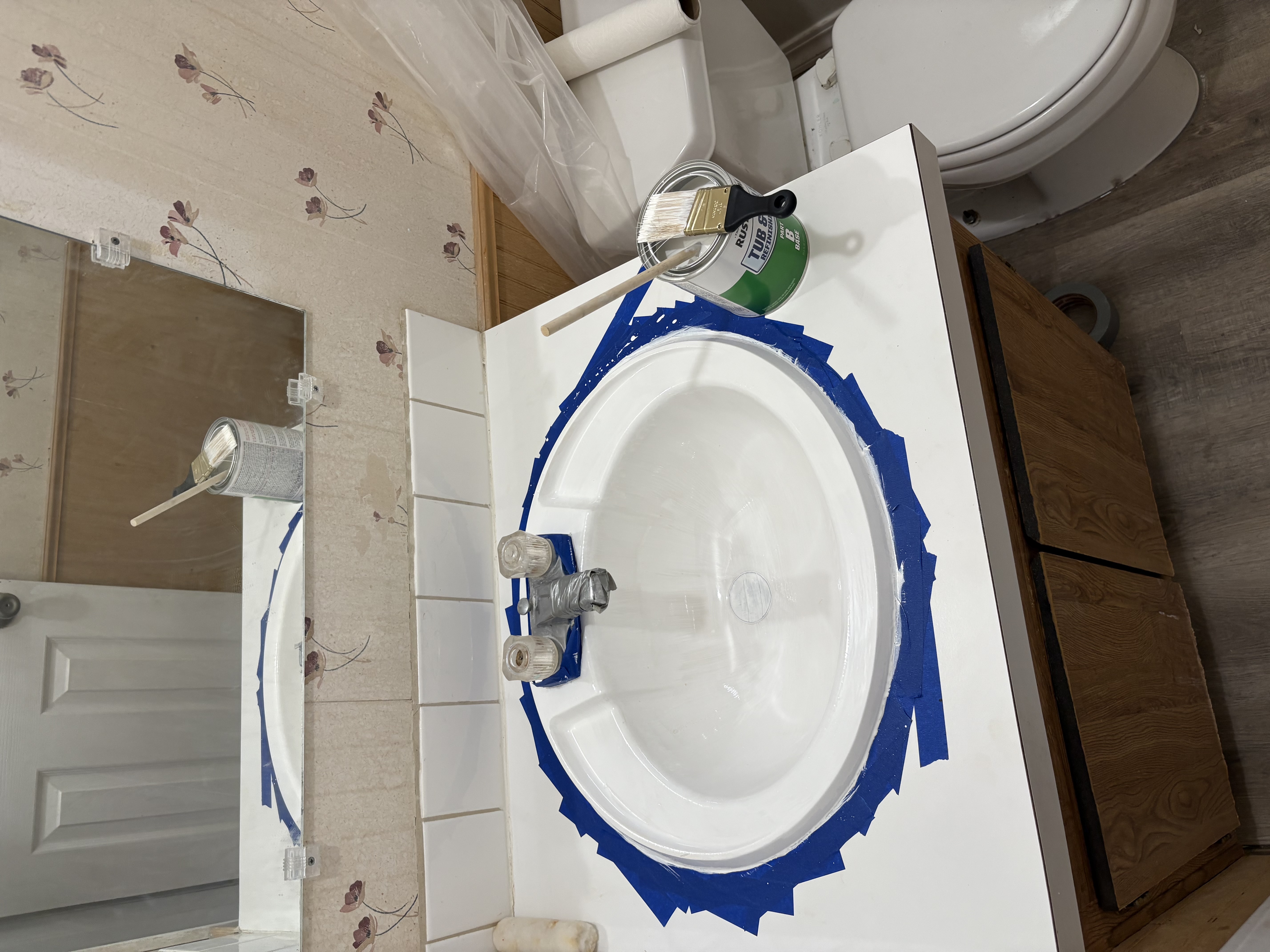 Sink refinishing – Rustoleum tub kit with blue tape masking